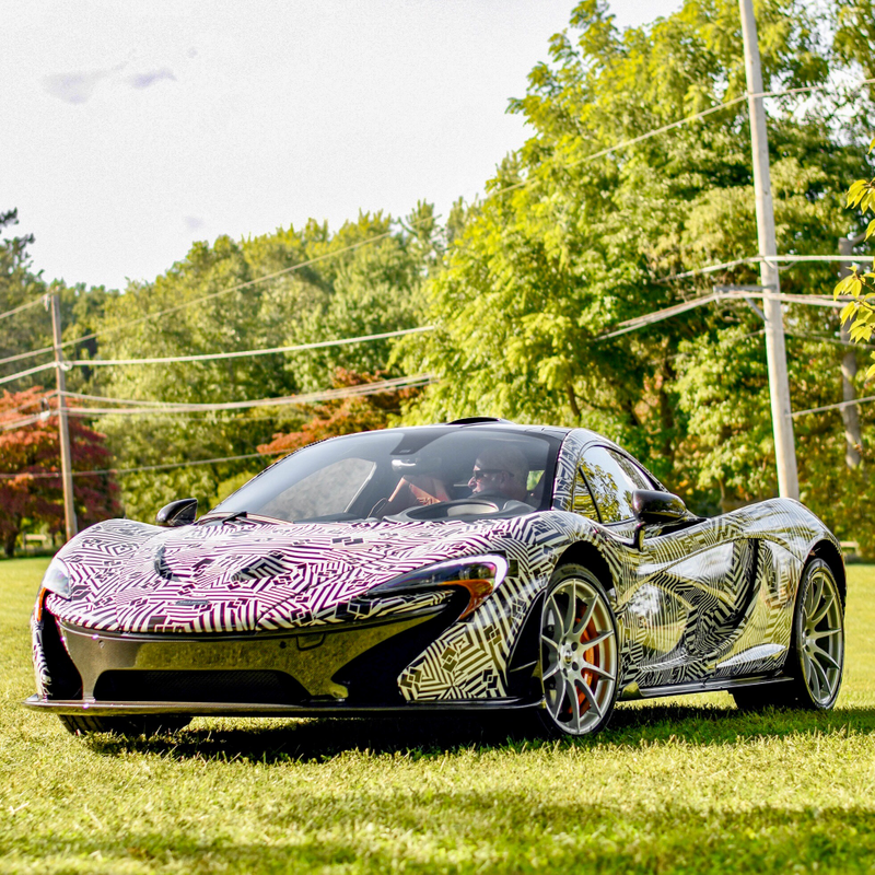 I know it’s well camouflaged, but there’s actually a McLaren P1 in this photo